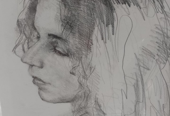 A charcoal drawing of a woman&rsquo;s face