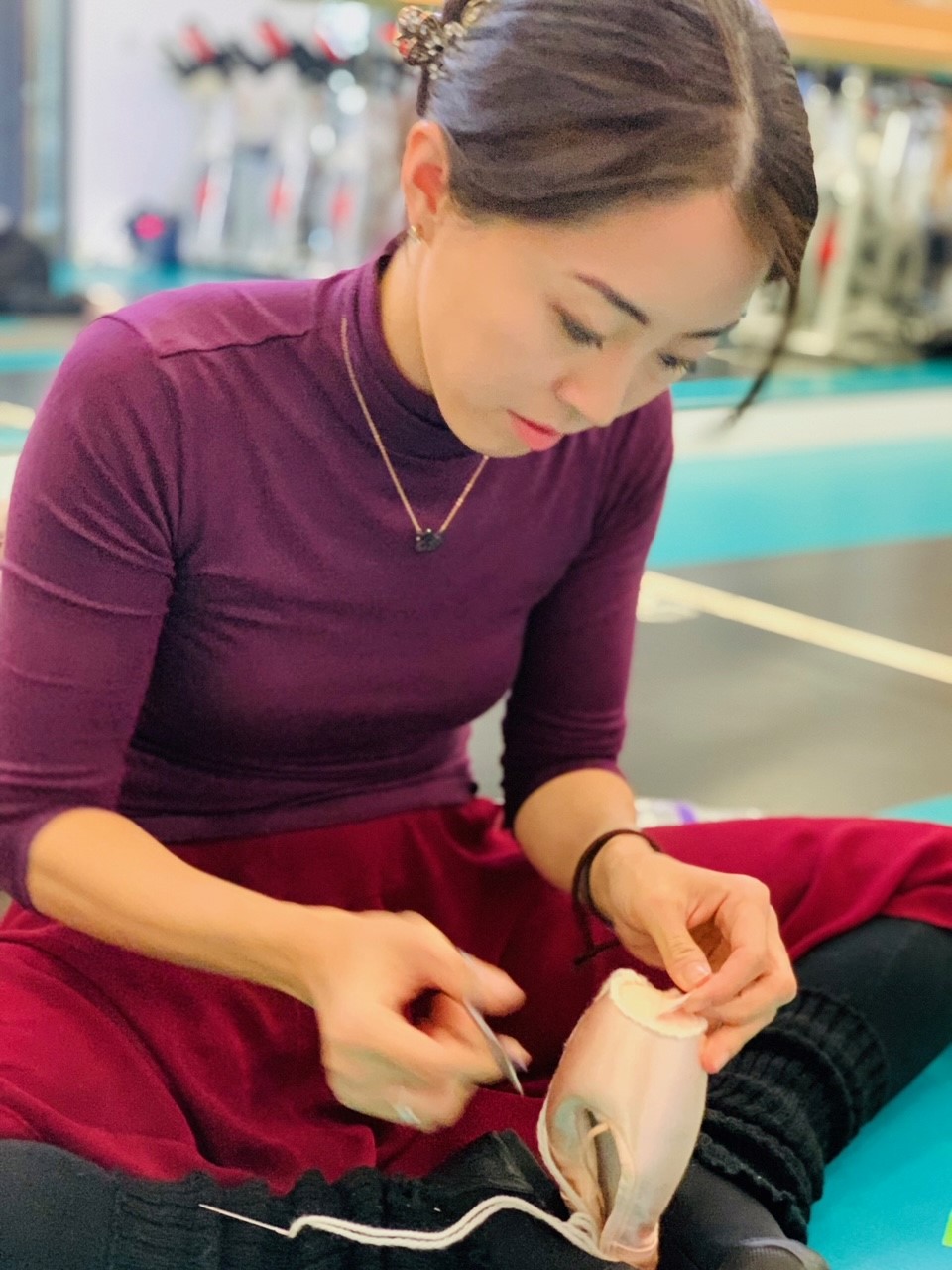 Kei Jones preparing ballet shoe