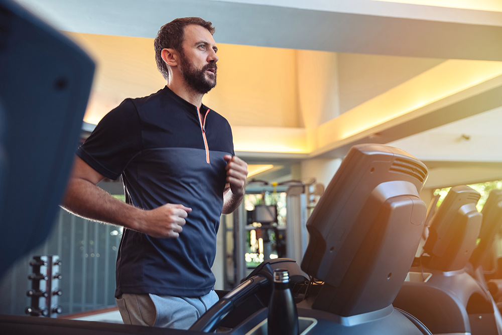 A man jogging on a treadmill