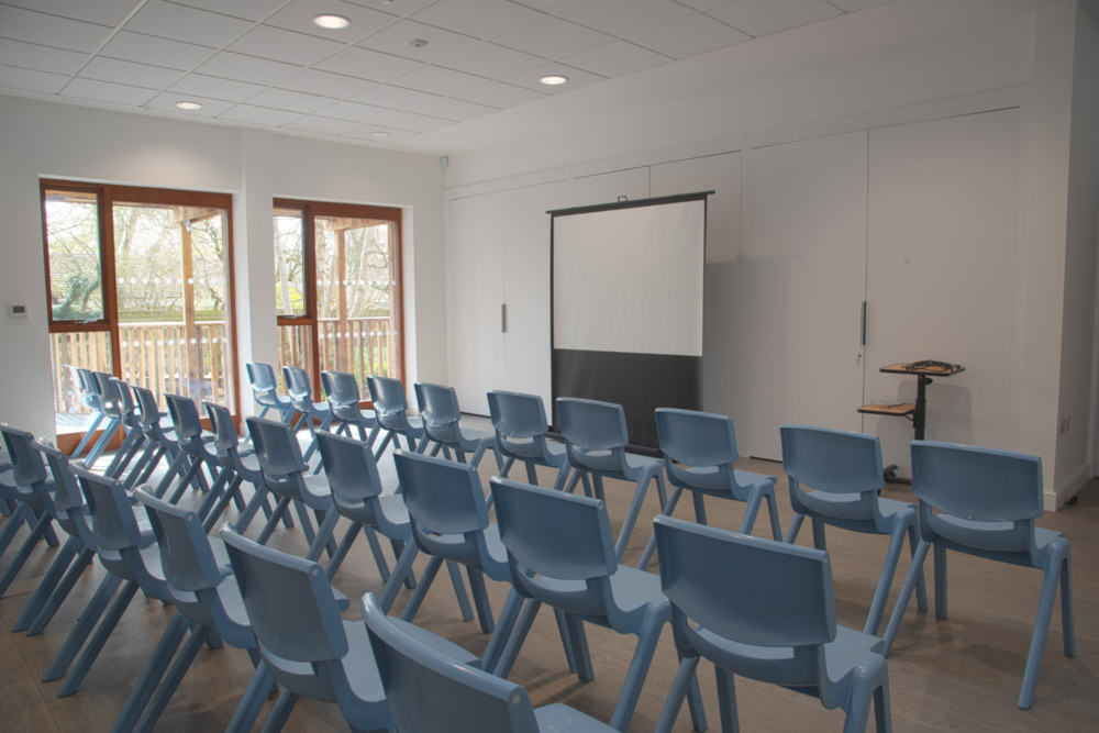 Projector and screen set up in the Alder room.