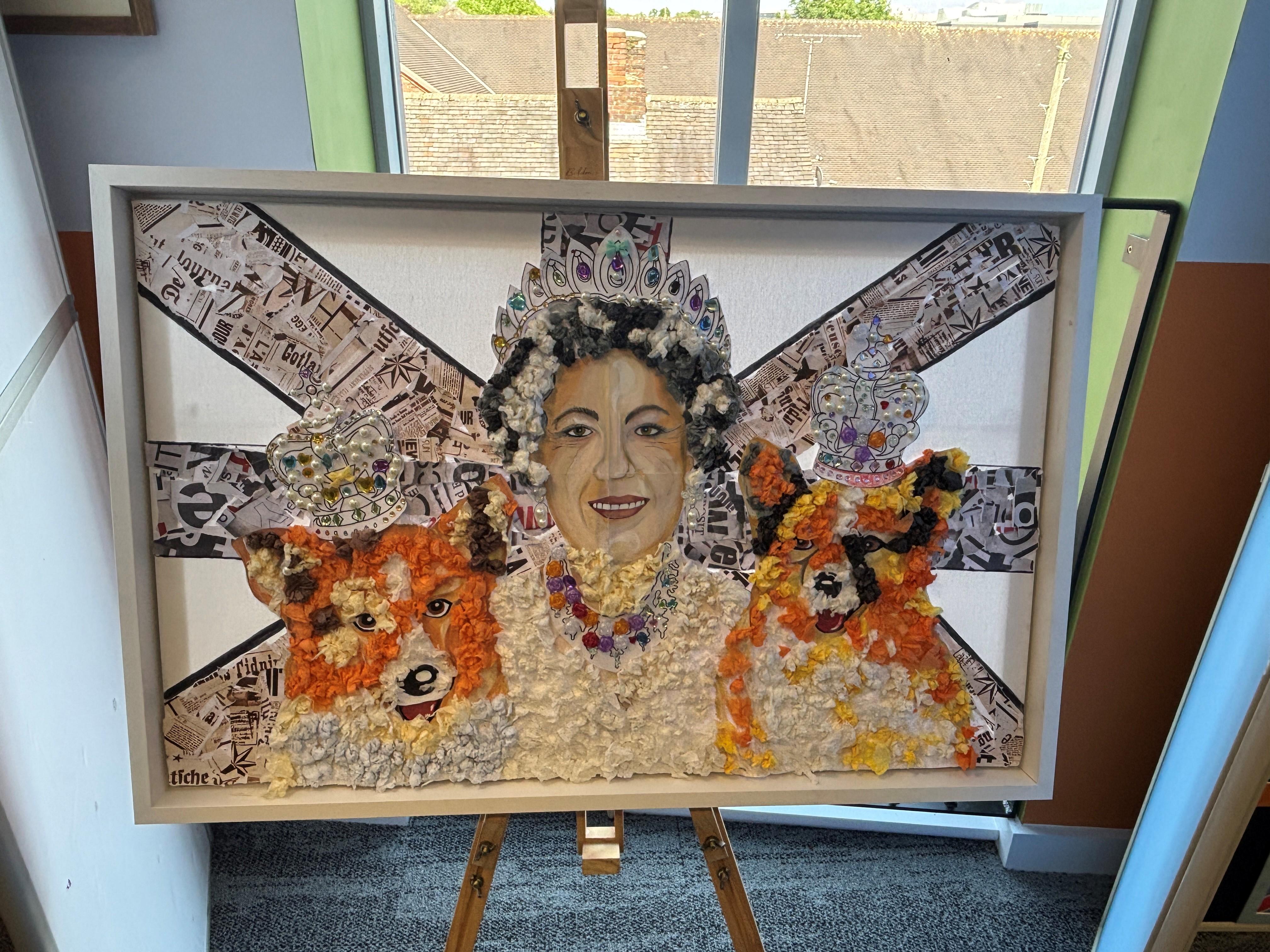 The Dudson class from Bluebell School created a fantastic 3D display featuring Queen Elizabeth II and her corgis wearing embellished crowns, alongside a Union Jack crafted from newspaper cuttings.
