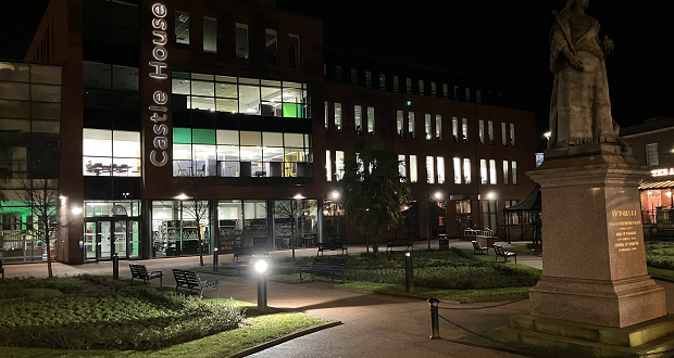 Image shows Castle House at night-time