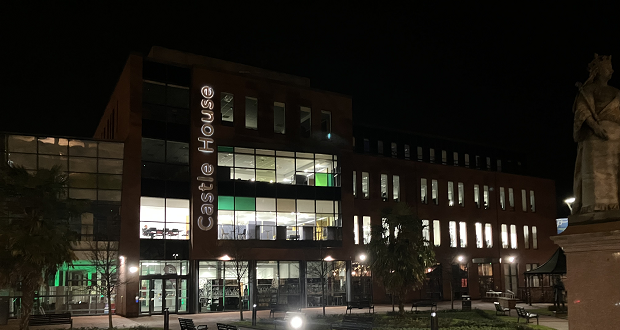 Image shows Castle House at night
