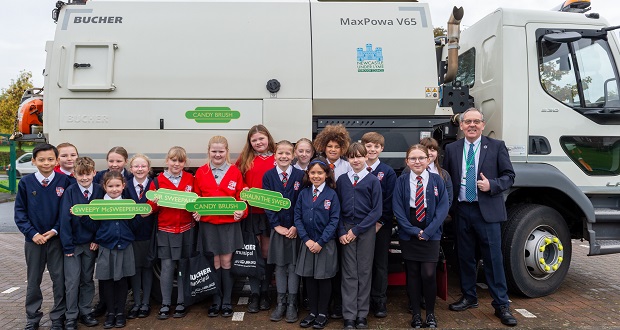 The image shows pupils from Bursley Academy and Chesterton Primary School with Cllr David Hutchison, and the newly-named ‘Candy Brush’.
