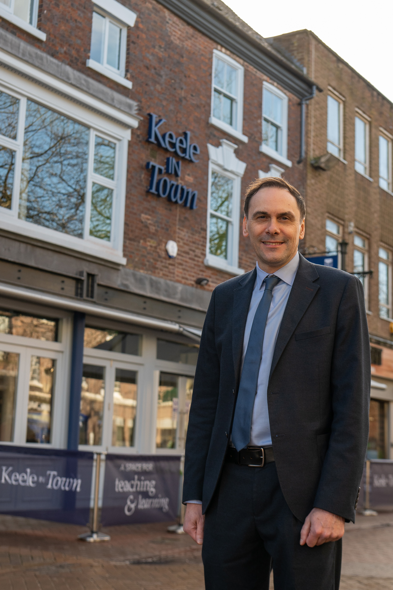 Image shows Simon Tagg outside the Keele in Town building.