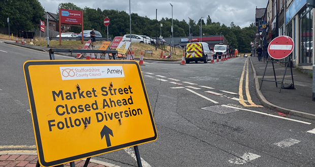 Image shows a sign warning of roadworks.