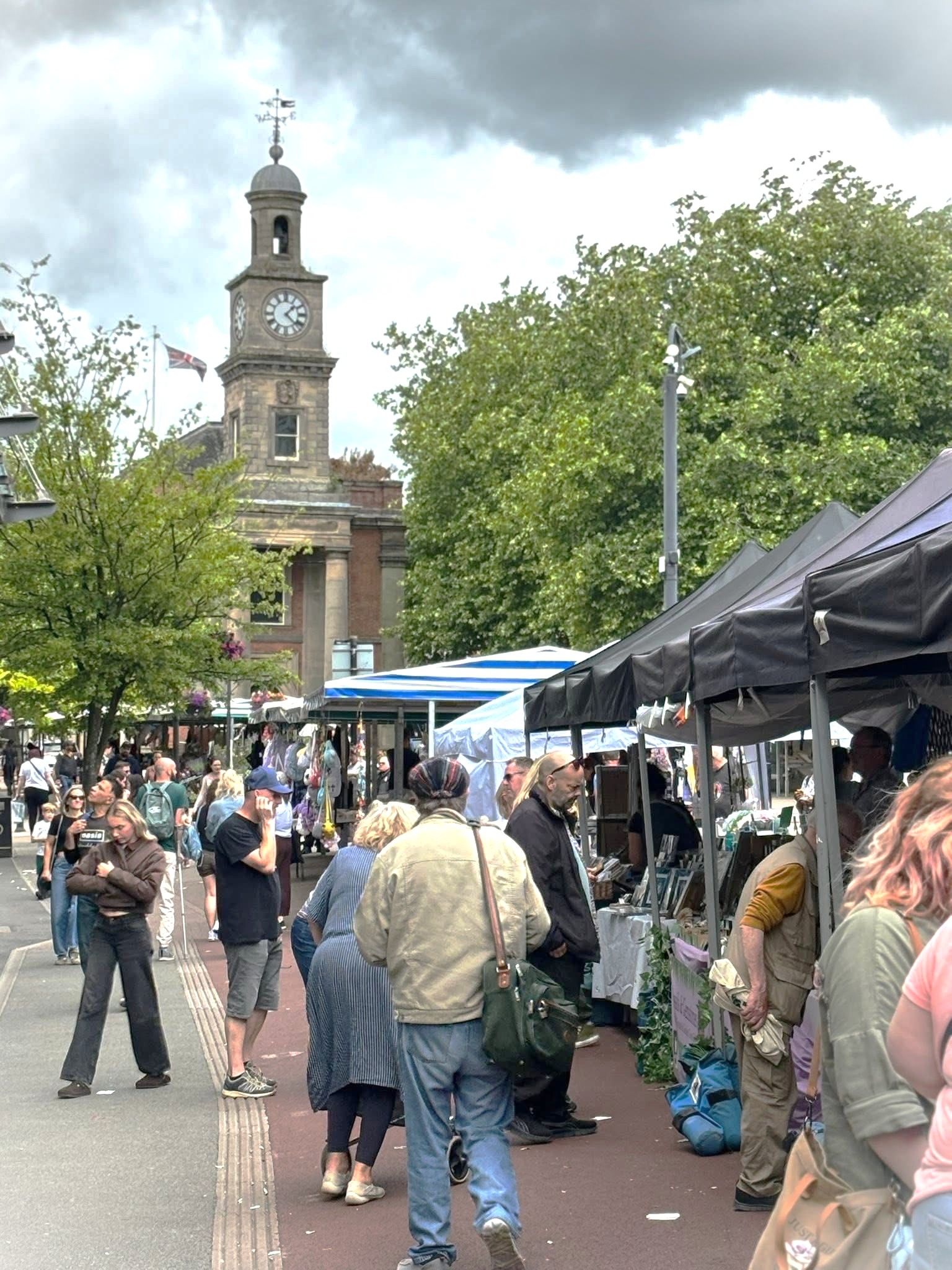 Image shows people shopping at the Makers Market