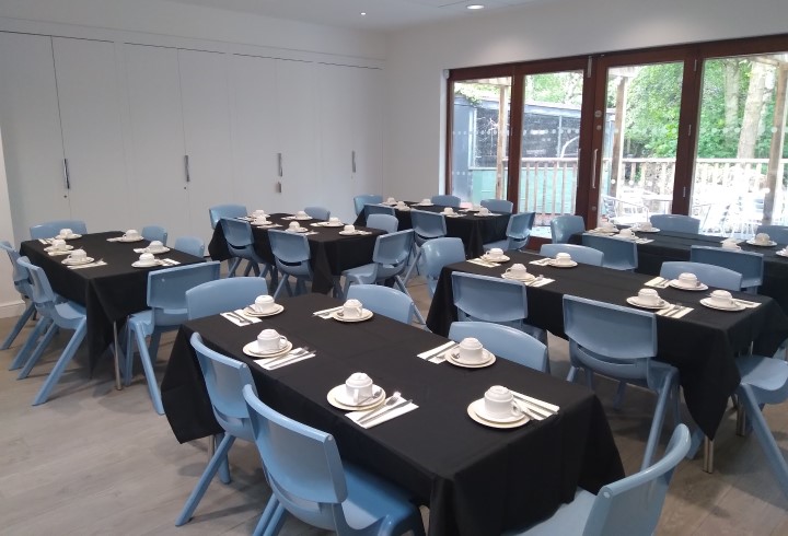 The Willow Room with black table cloths for a wake