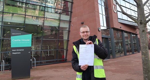 The image shows Paul Smith with his council tax leaflet.