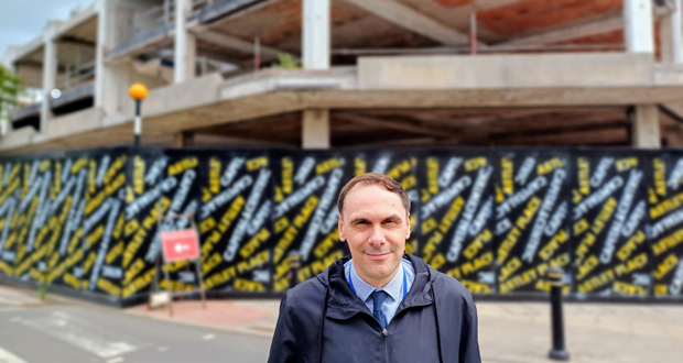 Image shows Council Leader SImon Tagg standing in front of Astley Place.