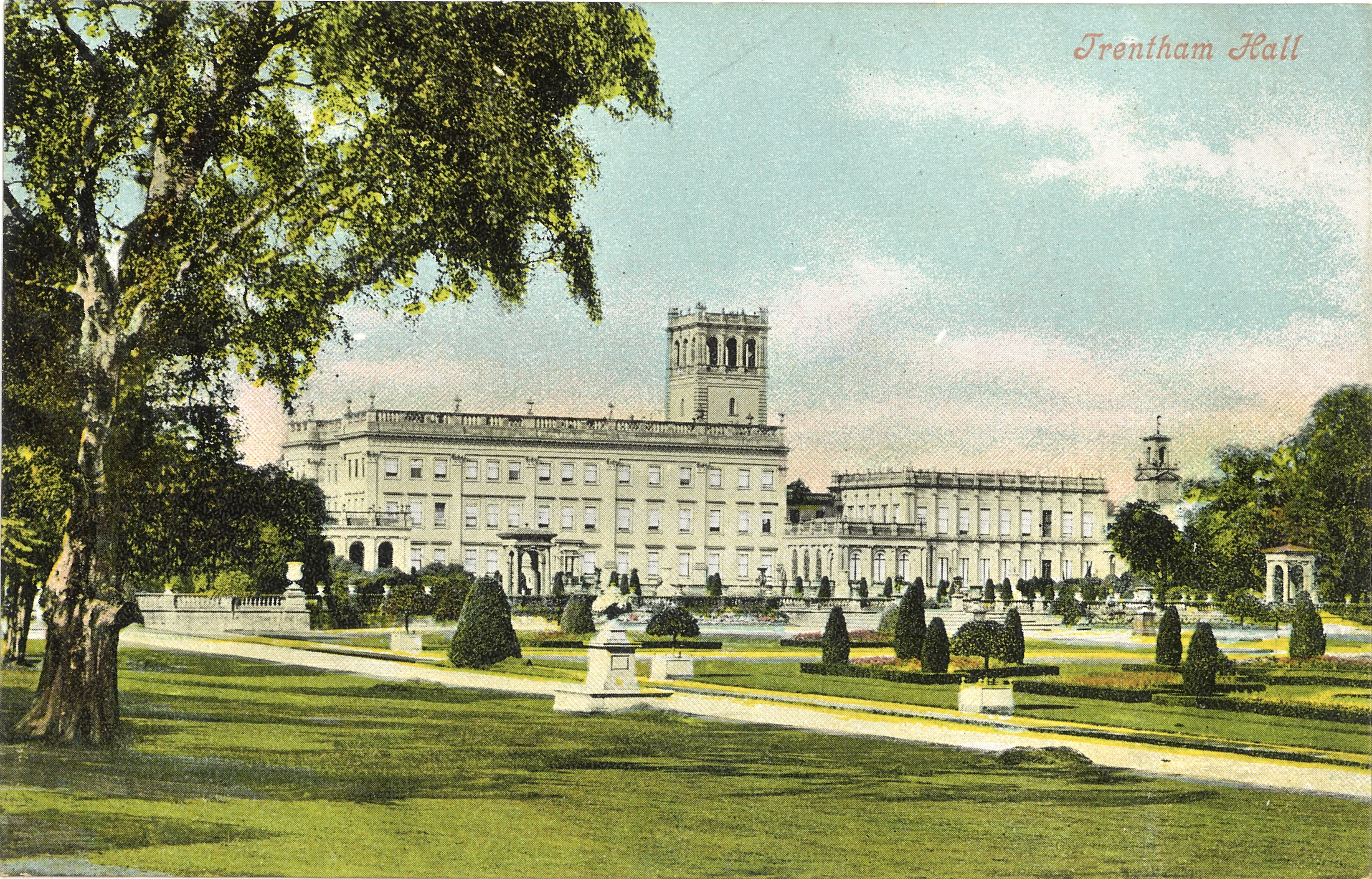 Colour postcard showing the original Trentham Hall, a white three story mansion with a clock tower, with Italian gardens to the front.