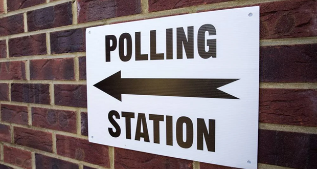Image shows a sign with the words 'polling station'